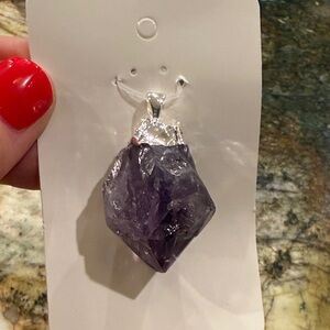 Amethyst pendant with silver metal